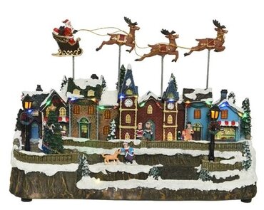 Lit Village Scene w/ Reindeer Flying Over Houses