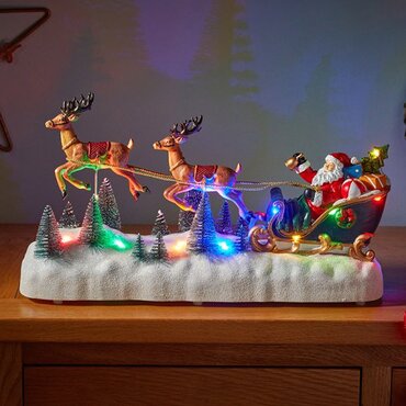 Lit Village Flying Reindeer Sleigh Scene